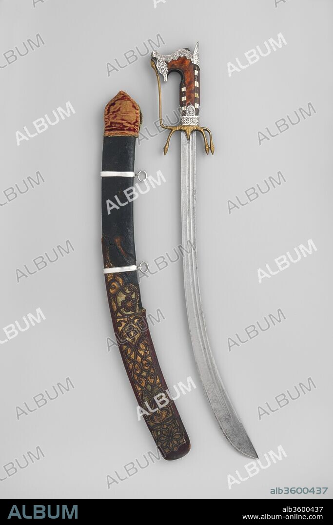 Nimcha (Saber) with Scabbard. Culture: hilt and scabbard, Algerian; blade, European. Dimensions: L. without scabbard 26 3/8 in. (67 cm); L. of blade 21 in. (53.3 cm); Wt. 1 lb. 6 oz.  (632 g); Wt. of scabbard 9 oz. (263 g). Date: hilt and scabbard, late 17th or early 18th century; blade 16th or 17th century.
This distinctly North African sword, or nimcha, probably dates from around the battle of Oran (1732), when that city, a haven for Turkish pirates, was besieged by the Spanish.  The openwork leather scabbard shows Ottoman influence.