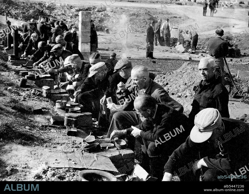 Life in an Internment Camp for German Nazis. Nazi internees cooking their own food from parcels received from outside the camp.. They are cooking on home-made stoves using wood chips as fuel, in Camp Roosevelt, Hamer Germany. At Hemer, in the British occupied zone of Germany 3,300 Nazis, mostly Gestapo and 6.6. men are interned in "camp Roosevelt', formerly a German prisoner-of-war camp. It was known as Stalag 6b. During the war, up to 30,000 allied troops were held there, and were finally liberated by the Americans, who gave the Camp its new name. After extensive enquiries by the Intelligence authorities some of the internees are released. May 1, 1946.