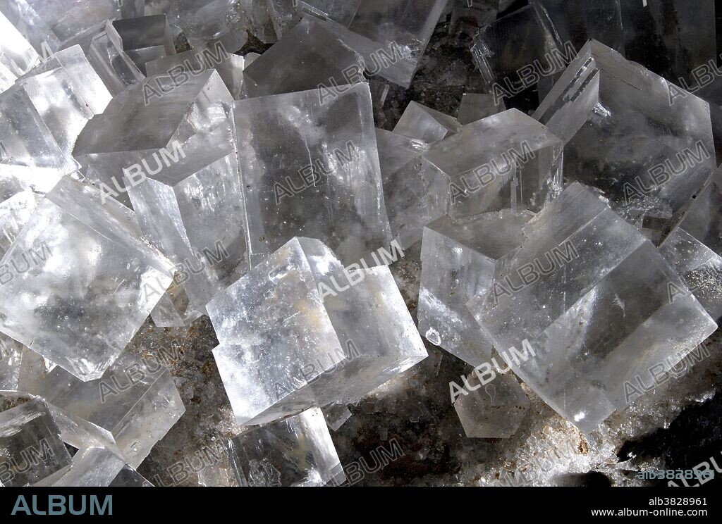 Halite crystals at the Czech National Museum, Prague. Halite is the mineral form of sodium chloride, NaCl, commonly known as rock salt. Halite forms isometric crystals. The cubic (or isometric) crystal is one of the most common and simplest shapes found in crystals and minerals.