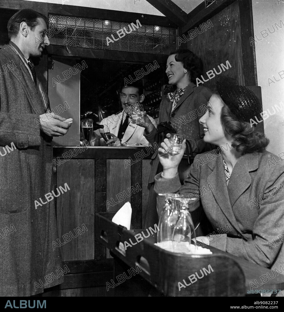 Train. Interior of the refreshment car. An idea for making a tavern look for refreshment cars. Leaded windows beams whitewashed walls. 1949.