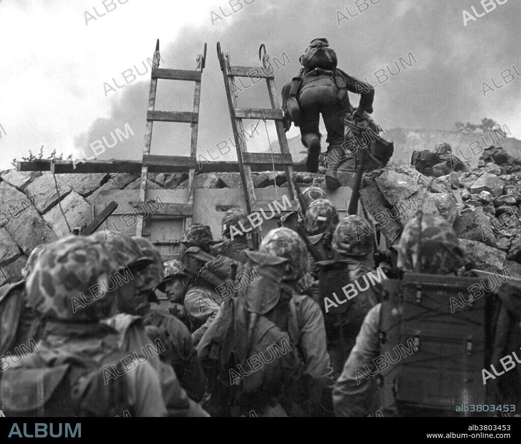 Captioned: "As against "The Shores of Tripoli" in the Marine Hymn, Leathernecks use scaling ladders to storm ashore at Inchon in amphibious invasion. The attack was so swift that casualties were surprisingly low." The Battle of Inchon was an amphibious invasion and battle of the Korean War that resulted in a decisive victory and strategic reversal in favor of the United Nations. The operation involved some 75,000 troops and 261 naval vessels, and led to the recapture of the South Korea capital Seoul two weeks later. The code name for the operation was Operation Chromite. The battle began on September 15, 1950 and ended on September 19. The battle ended a string of victories by the invading North Korean People's Army (NKPA). The subsequent UN recapture of Seoul partially severed NKPA's supply lines in South Korea. The majority of United Nations ground forces involved were U.S. Marines, commanded by General of the Army Douglas MacArthur of the U.S. Army. MacArthur was the driving force behind the operation, overcoming the strong misgivings of more cautious generals to a risky assault over extremely unfavorable terrain. Photograph credited to Staff Sergeant W.W. Frank, USMC, September 15, 1950.