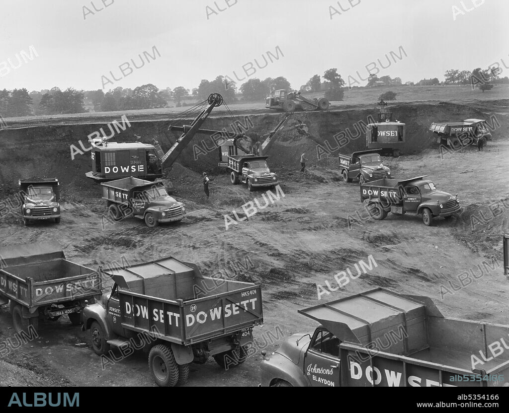 JOHN LAING PLC. Dowsett wagons in position ready to transport ballast, extracted from pits at Norton Park, for use in the construction of the London to Yorkshire Motorway (the M1). The gravel pits at Norton Park were located at grid reference SP6052163100.