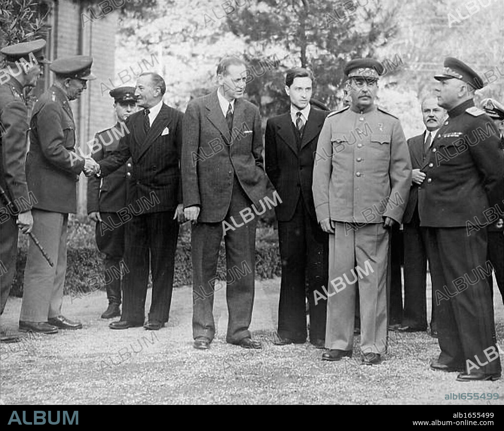 Tehran Conference, Iran, 28 Nov-1 Dec 1943.  Scene outside Russian Embassy with, centre, Roosevelt's adviser Harry Hopkis, Stalin's interpreter, Stalin, Molotov and General Voroshilov. Chief topic, opening of second front in Western Europe.