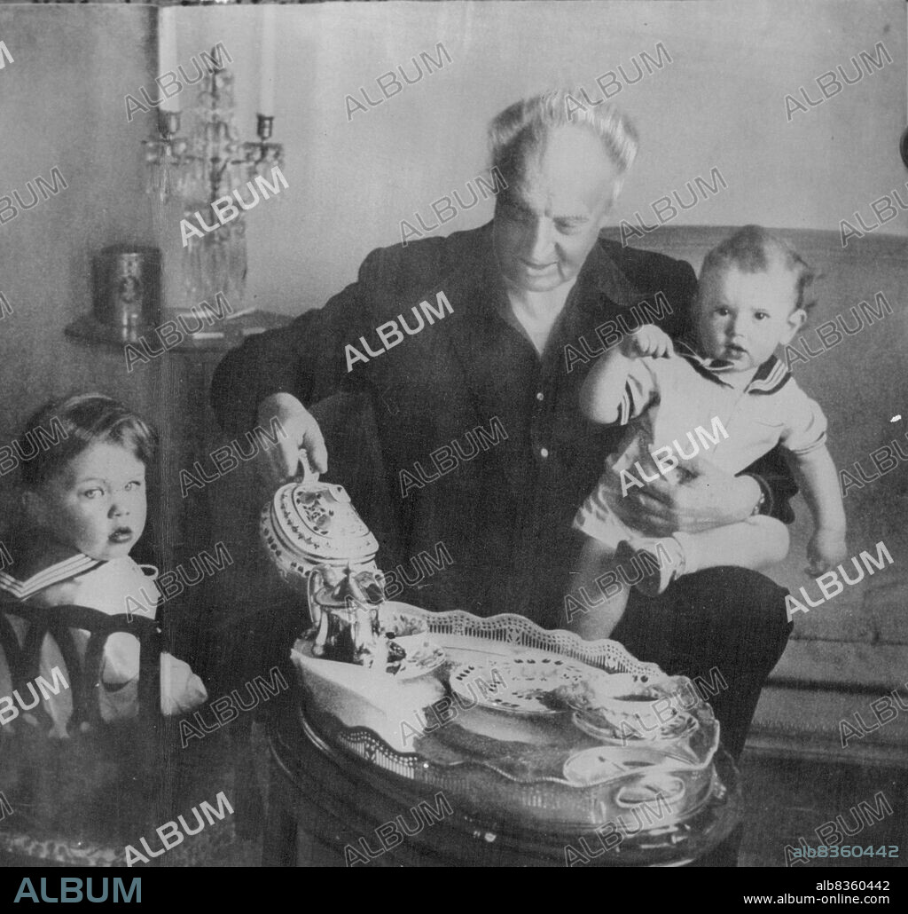 Conductor Leopold Stokowski, shown with his sons now aged 5 and 3 years, is nearly 70. His 1945 marriage with Gloria Vanderbilt has ended. December 28, 1955.