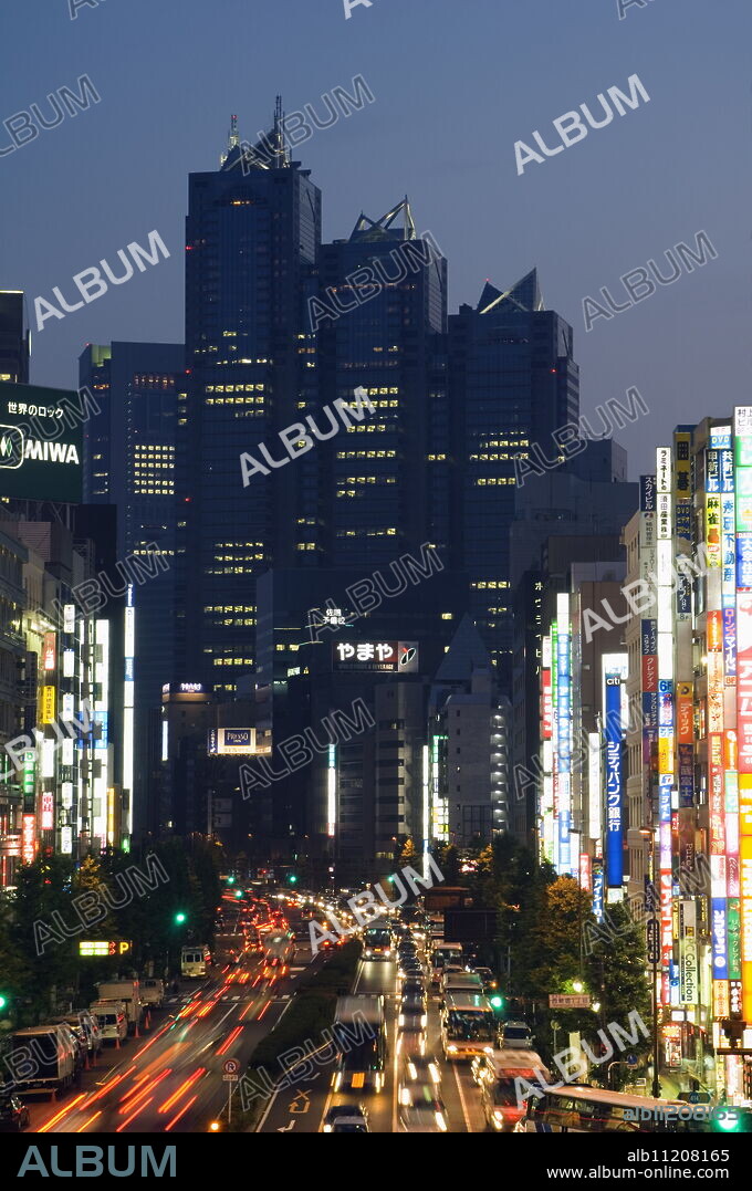 The Park Hyatt Hotel, location of the film Lost in Translation, and busy traffic at night, Shinjuku, Tokyo, Japan, Asia.