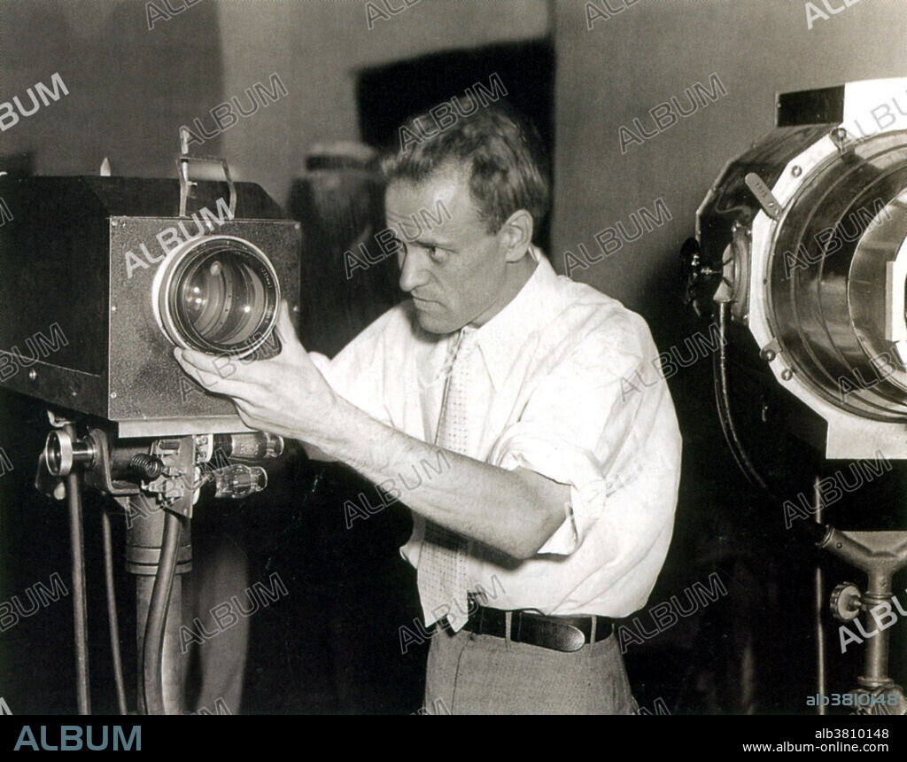Editorial use only . Captioned: Farnsworth adjusts a television camera during a demonstration of his television system at the Franklin Institute, Philadelphia, PA, August 28, 1934. Philo Taylor Farnsworth (1906-1971) was an American inventor and television pioneer. He made many contributions that were crucial to the early development of television, but is remembered for inventing the first fully functional all-electronic image pickup device (video camera tube). He called it the image dissector and it was the first fully functional and complete all-electronic television system. Farnsworth developed a television system complete with receiver and camera, which he produced commercially in the form of the Farnsworth Television and Radio Corporation, from 1938 to 1951. He held 165 patents, mostly in radio and television. In 1999, TIME magazine included Farnsworth in The TIME 100: The Most Important People of the Century.