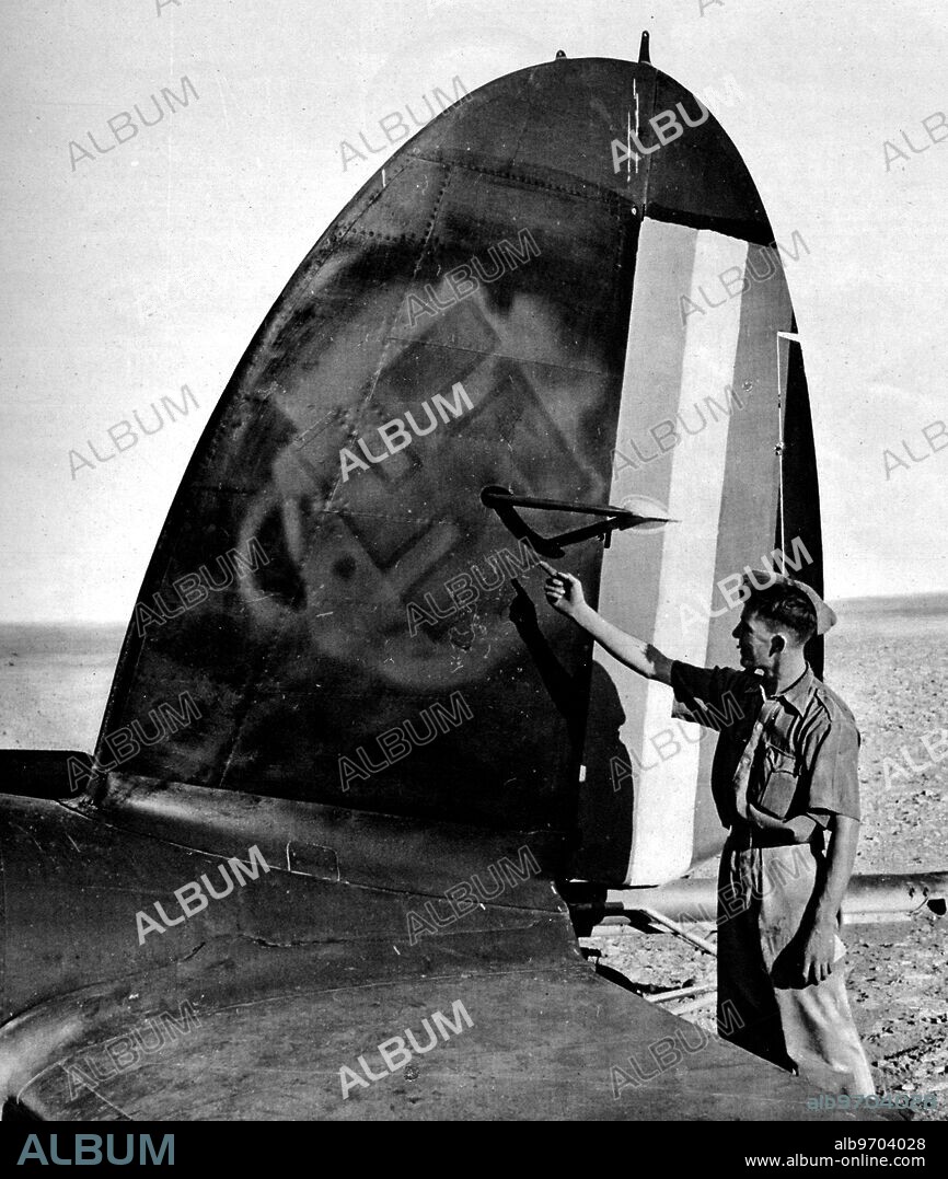 Absolute proof of collaboration between Vichy and the axis powers: the tail of a German aircraft, damaged at Palmyra, showing Vichy markings painted over the Nazi Swastika. Absolute proof of the cynical extent to which the Vichy French have been collaborating with Germany. August 1941.