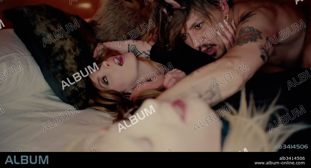 November 15, 2017 - inconnu - Actor Johnny Depp gets hot and sweaty with two women for rock star friend Marilyn Mansonâ€™s latest music video.Depp strips off to writhe with the women new track KILL4ME.The girls French kiss each other while Depp watches before he joins them on a bed watched by a masked Manson.The track is the latest single from Mansonâ€™s album Heaven Upside Down.It is the second time Pirates Of The Caribbean star Depp has starred in a music video for Manson from the album.In October Depp appeared as God opposite Manson playing a Satan-like figure in the promo film for the albumâ€™s title track.The new video, which comes with an adult content warning. Manson starts by singing the track on a revolving platform with his face adorned with make-up .Meanwhile the story shows glimpses of two women stripping off their clothes to put on something a little sexier.Depp seems to be watching from them on a screen in a red lit room before funding himself part of the story.He is shown on a staircase where he finds a piece of paper with a door number written on it.He goes to the door and is let into a room where the action takes place.The girls appeared enticed with Johnny, as they began putting on a gentle display before Marilyn joins in proceedings when things turn rough. Depp and Manson have been friends for years.In September, the rocker discussed an all-star jam session the duo embarked on after the American football Super Bowl. It included Joe Perry from Aerosmith and John Homme from Queens of the Stone Age. # JOHNNY DEPP DANS UN CLIP TRES HOT DE MARILYN MANSON. 15/11/2017