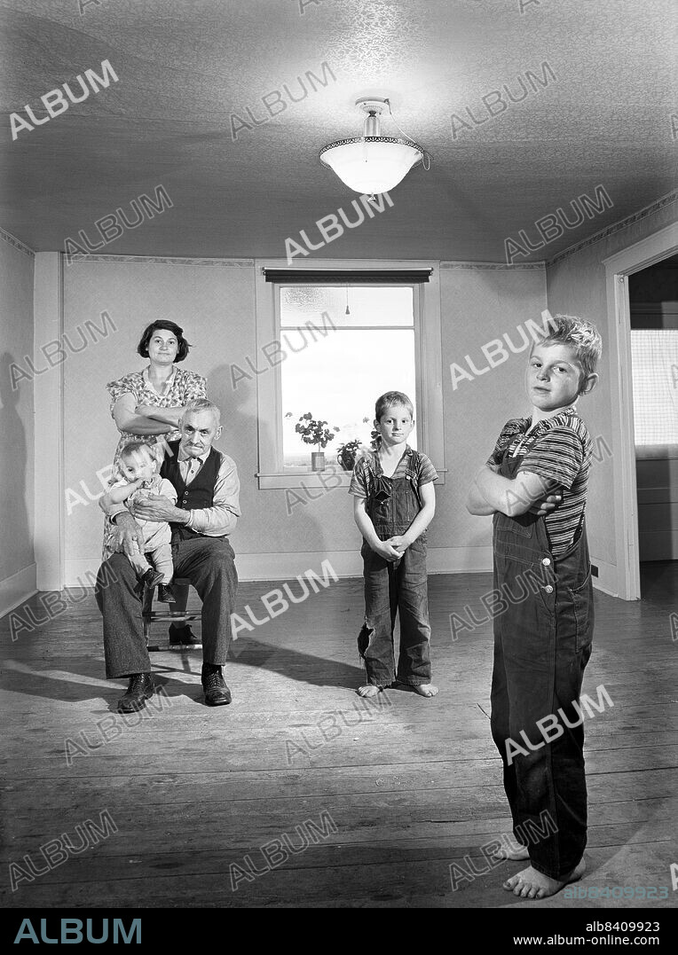 Mrs. Melvin Rivers with some of her children and father-in-law in new relocation corporation farm, near Orwell, New York, USA, Jack Delano, U.S. Office of War Information/U.S. Farm Security Administration, October 1941.