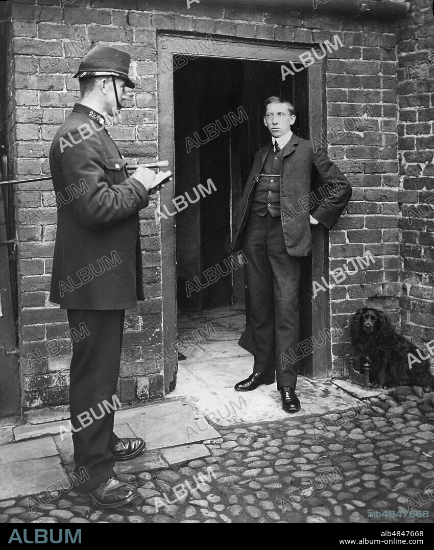 Magic Lantern slide, circa 1880, Victorian/Edwardian, social history. Policeman cautioning or arresting a man outside a house with a pet dog at the door. Probably a renactment for a magic lantern slide story.
