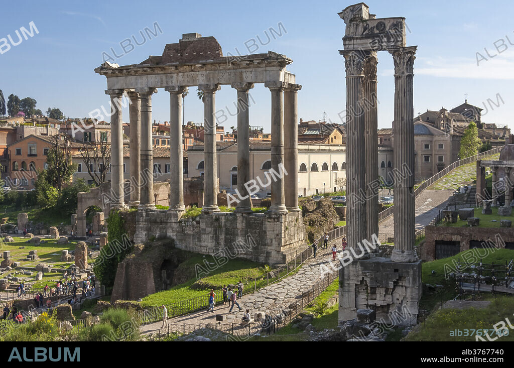 Ancient Roman Road traverses the columns and ruins in the Forum of Ancient Rome, UNESCO World Heritage Site, Rome, Lazio, Italy, Europe.
