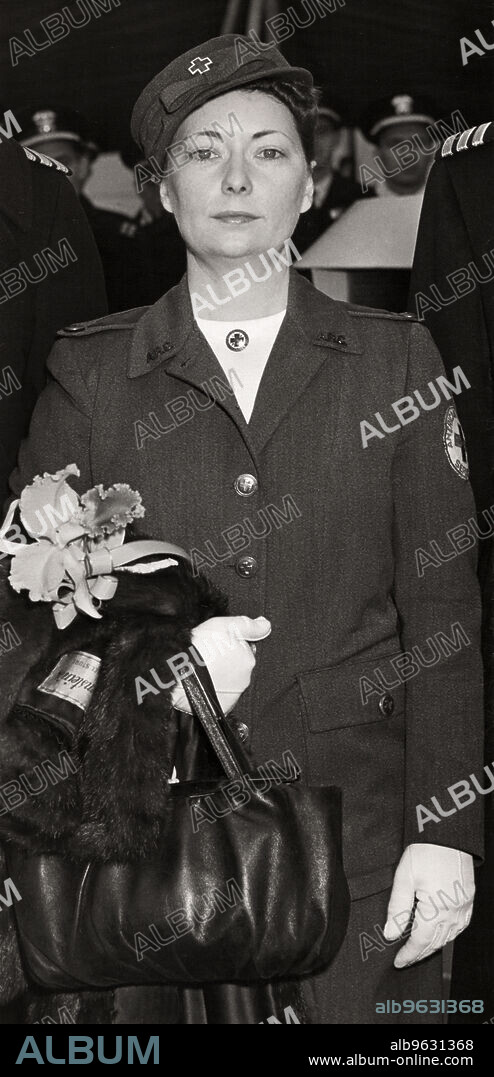 New York, New York, December 24, 1941 Author Margaret Mitchell in her Red Cross uniform during the commissioning ceremonies for the light cruiser USS Atlanta at the New York Navy Yard in Brooklyn.