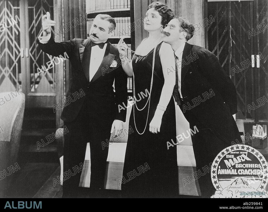 GROUCHO MARX and MARGARET DUMONT in ANIMAL CRACKERS, 1930, directed by VICTOR HEERMAN. Copyright PARAMOUNT PICTURES.