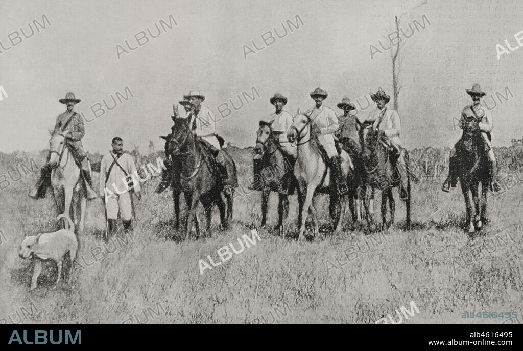 Guerra de Independencia de Cuba (1895-1898). Isla de Cuba. El titulado "Presidente de la República de Cuba en Armas" entre los años 1897-1898, Bartolomé Masó (1830-1907) y su acompañamiento. Fotograbado por Laporta. La Ilustración Española y Americana, 1898.