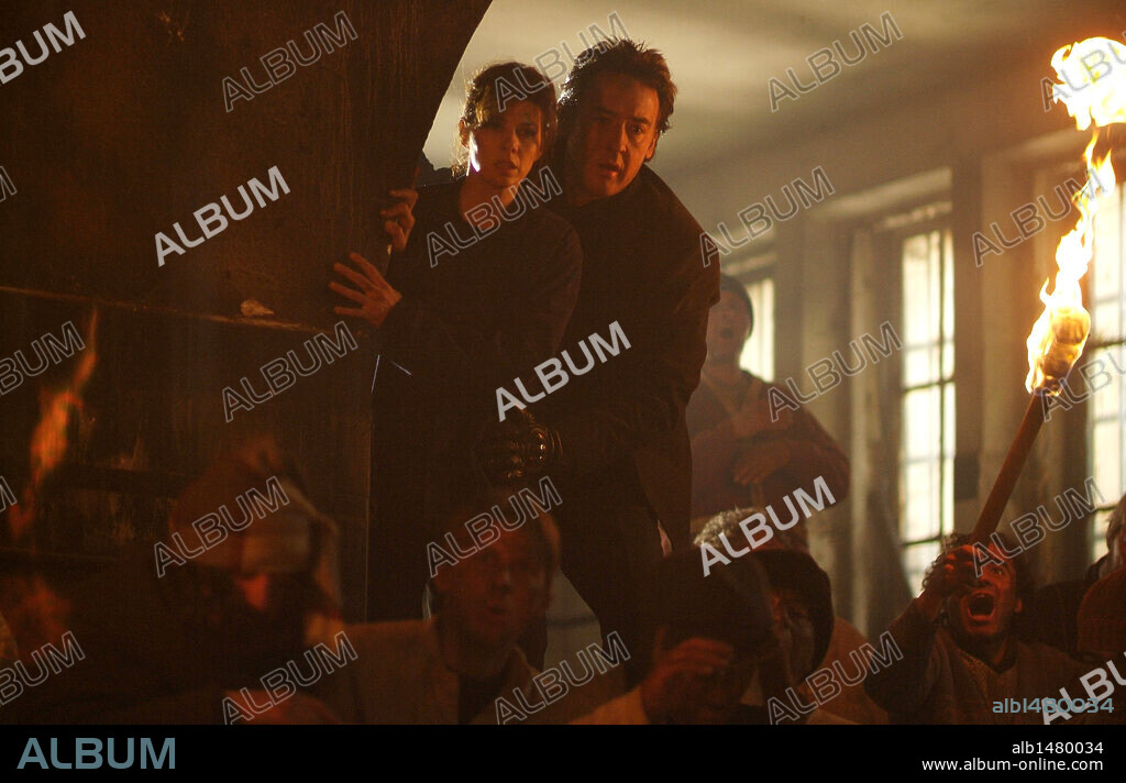 JOHN CUSACK and MARISA TOMEI in WAR, INC., 2008, directed by JOSHUA SEFTEL. Copyright NEW CRIME PRODUCTIONS/B & W FILMS/BOYANA FILM STUDIOS/ / VERSANO, SIMON.