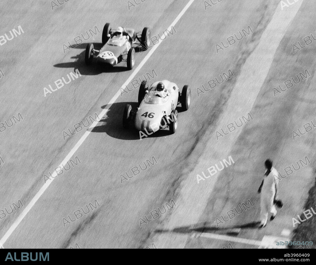 Italian Grand Prix, Monza, 1961. Dan Gurney, in the Porsche, is leading Stirling Moss driving the Lotus during the Italian Grand Prix in Monza. Gurney finished second, while Moss was forced to retire on lap 37 with a wheel bearing problem.