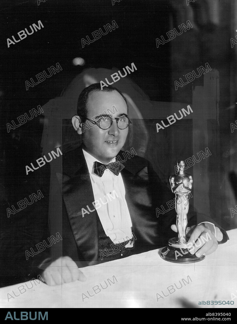 Acclaimed Year's Outstanding Director -- Norman Taurog, whose direction of Paramount's "Skippy" was voted the best of 1931 by the Academy of Motion picture Arts and Sciences. Taurog, whose other pictures this year include "Huckleberry Finn" and "Sooky", was presented with the gold statuette in the presence of Charles Curtis, Vice-president of the United States; leaders in national, state and civic life and practically all the important figure of filmland. January 12, 1932. (Photo by Paramount Photo).