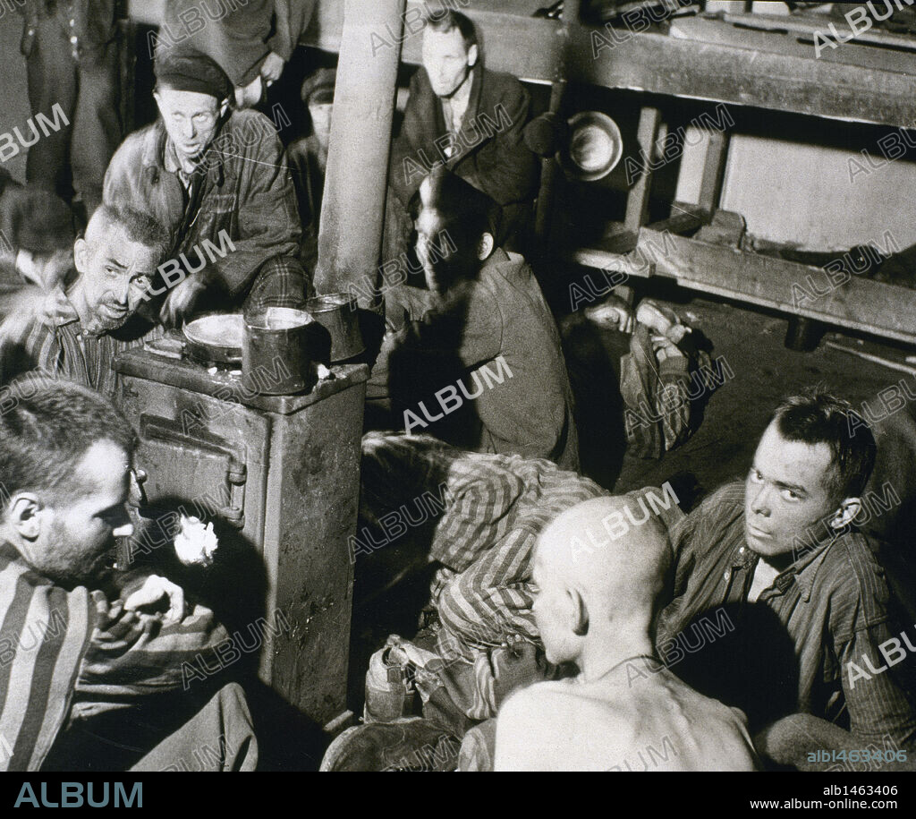 WORLD WAR II. Sandbostel Concentration Camp. Political prisoners and British troops inside a bunkhouse in STALAG XB camp. Germany.
