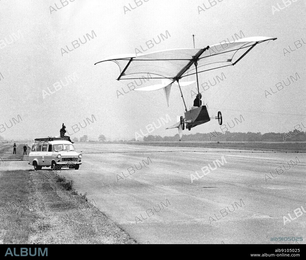 A modern reconstruction of Cayley's glider in flight. The first glider full-size man-carrying was designed by Sir George Cayley of Brompton Hall, Brompton, Yorkshire and described in the Mechanics Magazine for 15th September 1852. The aircraft was a monoplane with a kite-shaped wing and an adjustable tail-plane and fin. The total wing area is estimated to have been 500 sq ft and the weight of the machine 300 lb. The pilot was carried in a boat-shaped nacelle with tricycle undercarriage by means of a tiller control, he could operate a second smaller tail unit which served as both rudder and elevator.. ©TopFoto.
