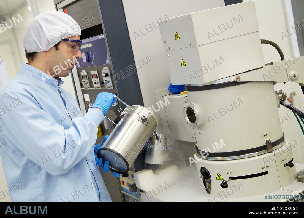 Pouring liquid nitrogen to improve the vacuum in the chamber to deposit thin films Vacuum Coating Systems Cleanroom Microelectronics and Microsystems Unit CEIT Center of Studies and Technical Research University of Navarra, Donostia, Gipuzkoa, Basque Country, Spain.