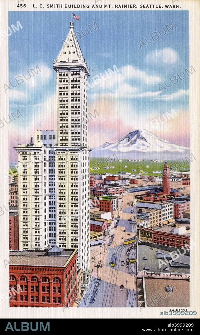 Smith Tower, Seattle, Washington, USA, 1934. Vintage postcard showing a bird's eye view of the skyscraper, the city and the distant Mount Rainier. Situated on Pioneer Square, the 42-storey Smith Tower is the oldest skyscraper in Seattle. Completed in 1910, it was built for Lyman Cornelius Smith, a firearms and typewriter magnate. It was the tallest building on the US west coast until the Space Needle was built in Seattle in 1962.