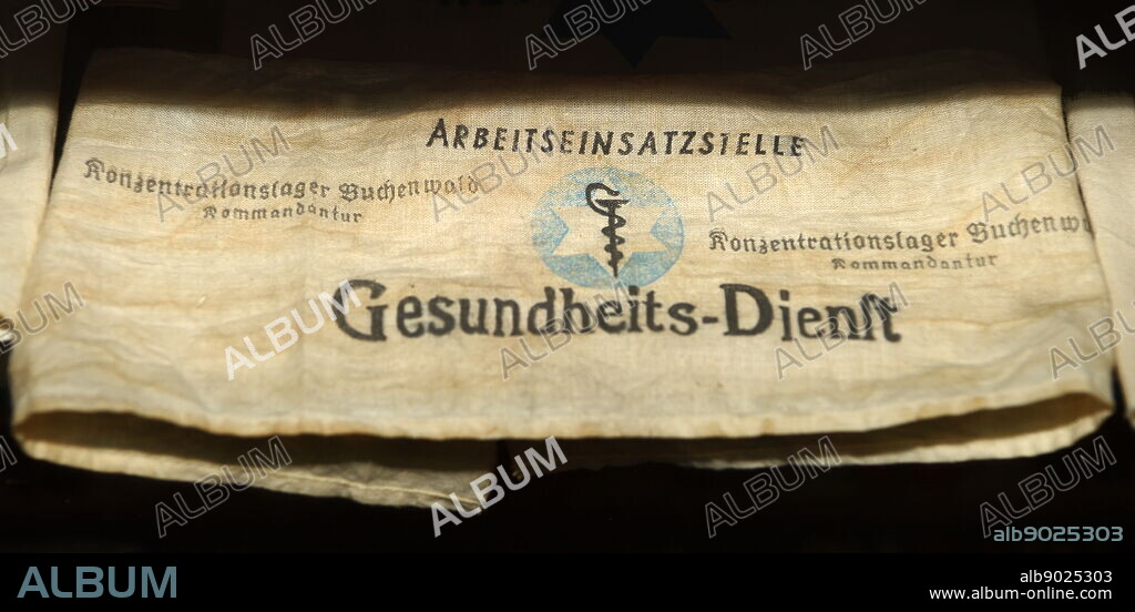 Armband worn by a medical worker prisoner at Buchenwald a Nazi concentration camp established near Weimar, Germany, in July 1937. It was one of the first and the largest of the concentration camps within Germany's 1937 borders. The camp gained notoriety when it was liberated by the United States Army in April 1945.