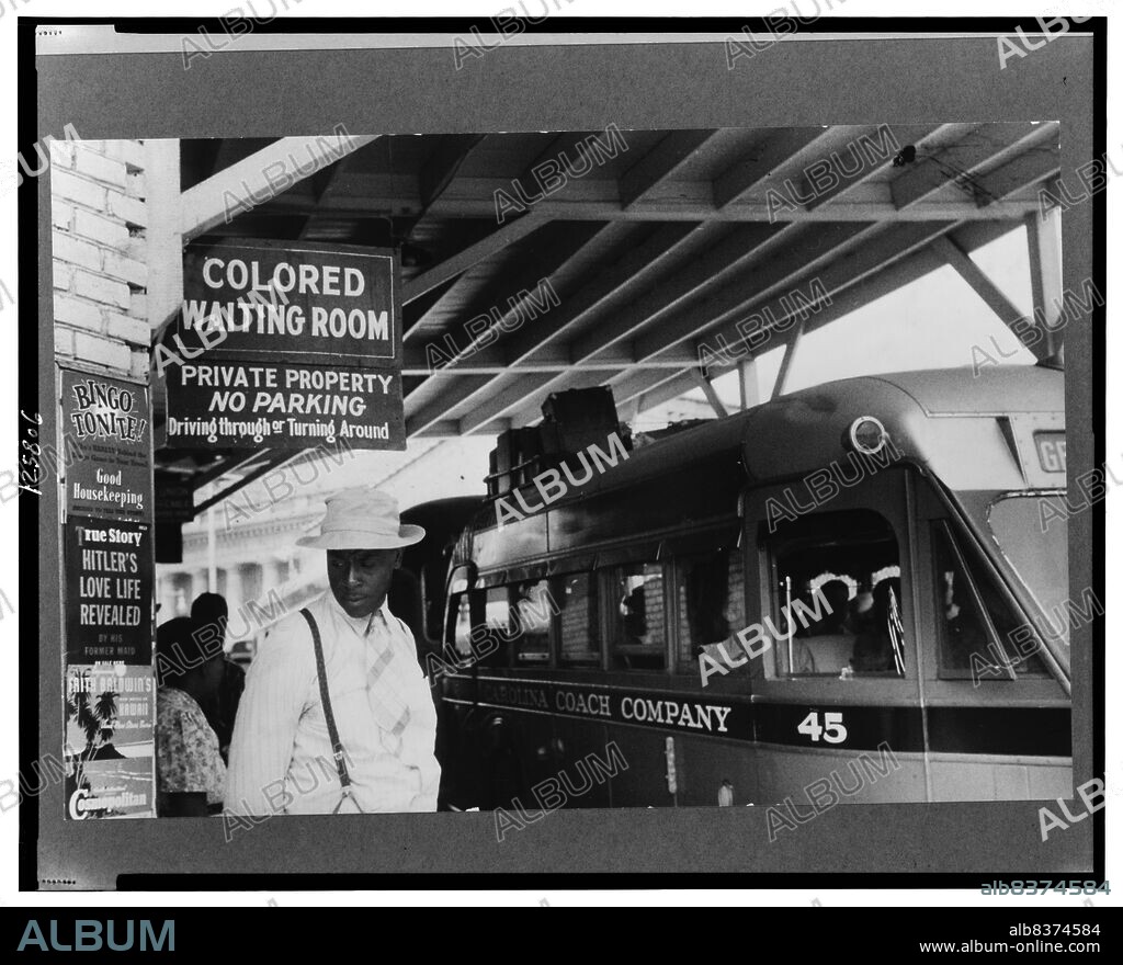 Photo taken at the bus station in Durham, North Carolina in May 1940, showing the Jim Crow signs of racial segregation. Jack Delano, photographer.