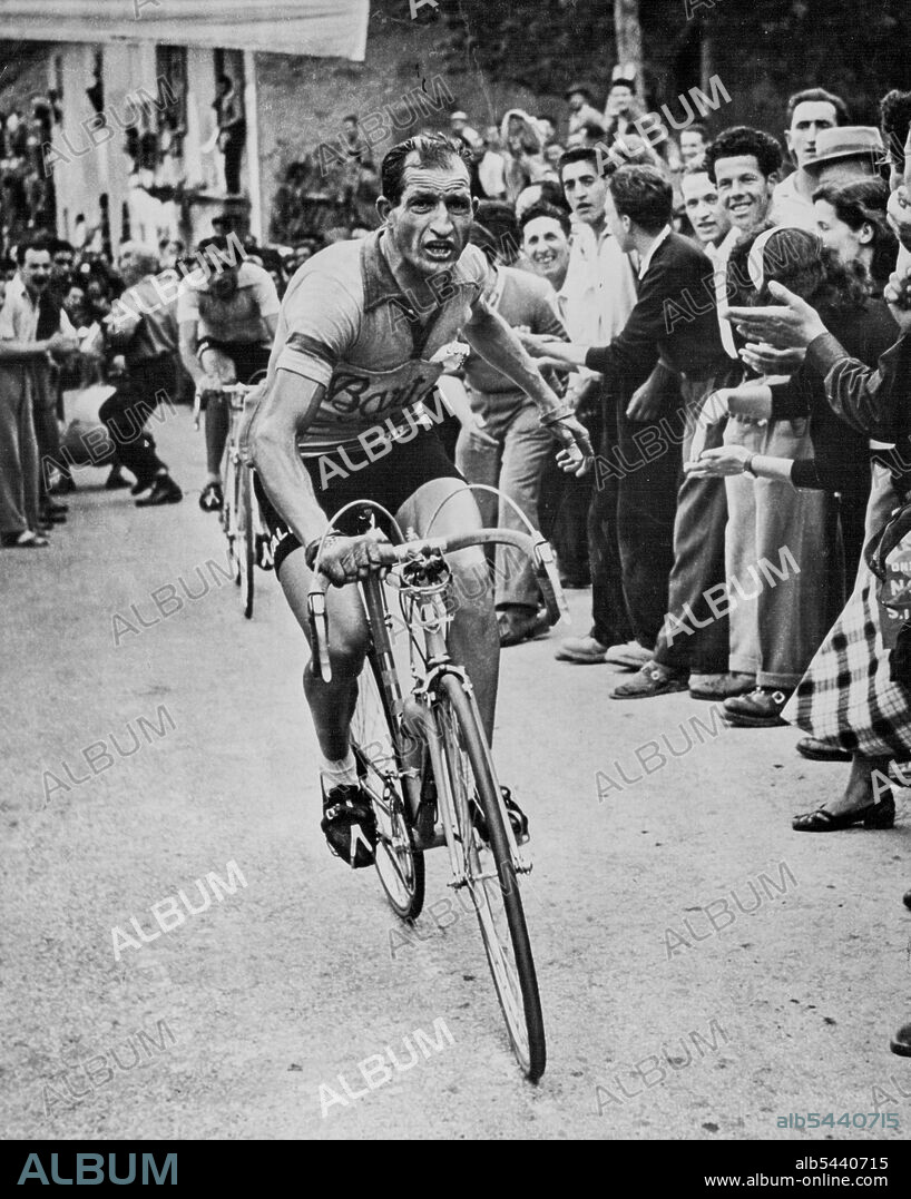 The Man who Stopped a Revolution - Not with standing the frown on his face, Gino Bartali feels a surge of satisfaction as he beats Fausto Coppi in the 1951 Tour of Italy. This picture was made at the finishing point, Col di Neva. He won the 1951 Tour of Italy. Bartali could have been mayor, decided to stick to his cycling. August 14, 1954. (Photo by United States Information Center). sports, sport, athlete, athletic,.