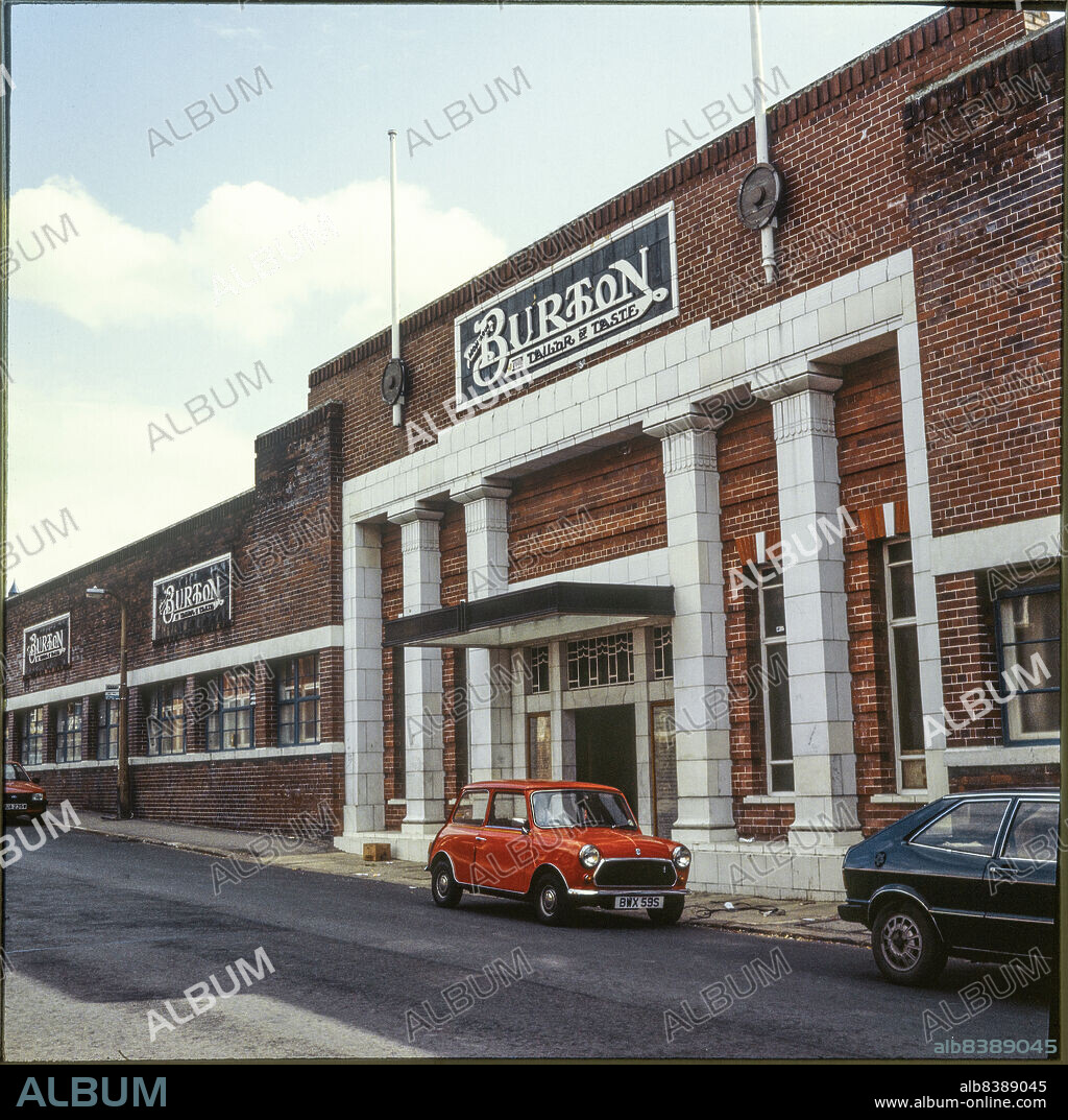 NICHOLAS ANTHONY JOHN PHILPOT. Hudson Road Mills, Hudson Road, Leeds, 1977-1983. The entrance front of Burton's Hudson Road Mills clothing factory seen from the north, with a red Mini parked outside.