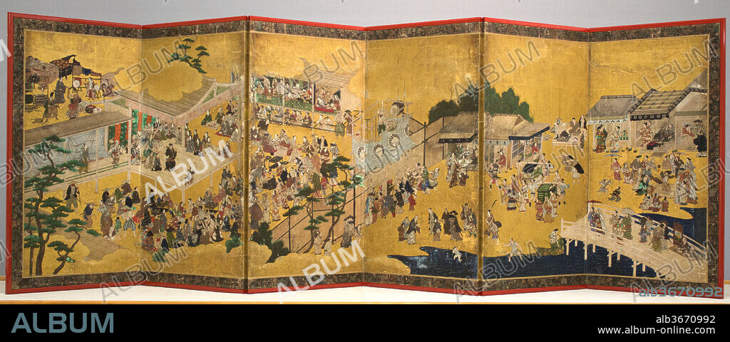 Women's Kabuki (Onna kabuki zu byobu). Artist: Studio of Kano Takanobu (Japanese, 1571-1618). Culture: Japan. Dimensions: Image: 31 1/2 in. × 8 ft. 9 11/16 in. (80 × 268.4 cm)
Overall: 36 in. × 9 ft. 2 5/16 in. (91.5 × 280.2 cm). Date: probably mid- to- late 1610s.
The origins of Kabuki theatre are captured in this gloriously complex and meticulously detailed genre screen from the second decade of the seventeenth century. In its earliest phase, Kabuki was performed by female dancers or courtesans, playing both male and female roles in sexually provocative skits. Kabuki as we know it today, a highly respectable "classical" theatre performed entirely by male actors (for roles of both genders) in plays with complex plots, did not begin to emerge until the end of the seventeenth century.  
The focus of this exuberantly detailed genre screen is the stage performance of a young woman dressed as a man, performing a skit called Chaya asobi, or "Teahouse Entertainments." She is dressed as a gallant samurai in flashy robes, posturing suggestively as she hoists a sword with gilded sheath behind her neck. She is accompanied at the front of the stage by her comic sidekick, the manservant Saruwaka ("Young Monkey")--also played by a woman--holding a branch of maple leaves or flowers. They engage in saucy dialogue with a female teahouse owner or courtesan in the right corner of the stage--a role sometimes played by a young man, according to records of performances of the day. Audiences apparently delighted in the erotic suggestiveness of cross-dressing. 
This recently rediscovered work is believed to be the left screen of a pair; this scene of Kabuki was juxtaposed with depictions of merrymaking in the Kitano district of Kyoto. Both screens are thought to have been created in the Kano studio, probably under the direction of Takanobu, head of the atelier in the early seventeenth century.