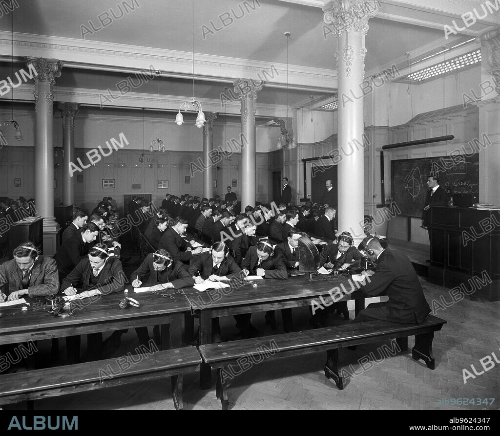 BEDFORD LEMERE AND COMPANY. Trainee radio operators, Marconi House, the Strand, London, 1913. Operators diligently training to use Marconi equipment. Photograph commissioned by Marconi Company.