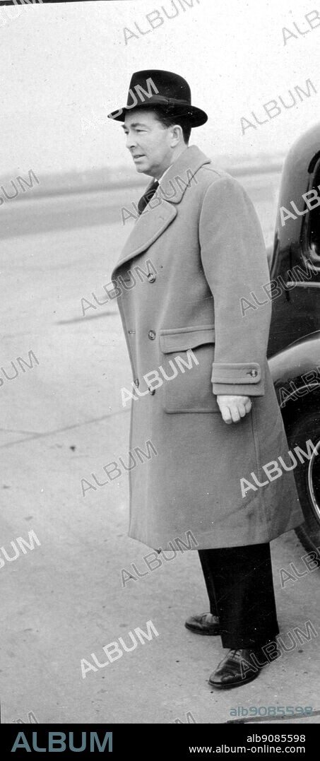 Sir Hartley Shawcross, the Attorney General, dashes back from Paris for the Tribunal at Church House, Westminster, December 1948. The Right Honourable Hartley William Shawcross, Baron Shawcross, (1902-2003), was a British barrister and politician and the lead British prosecutor at the Nuremberg War Crimes tribunal.