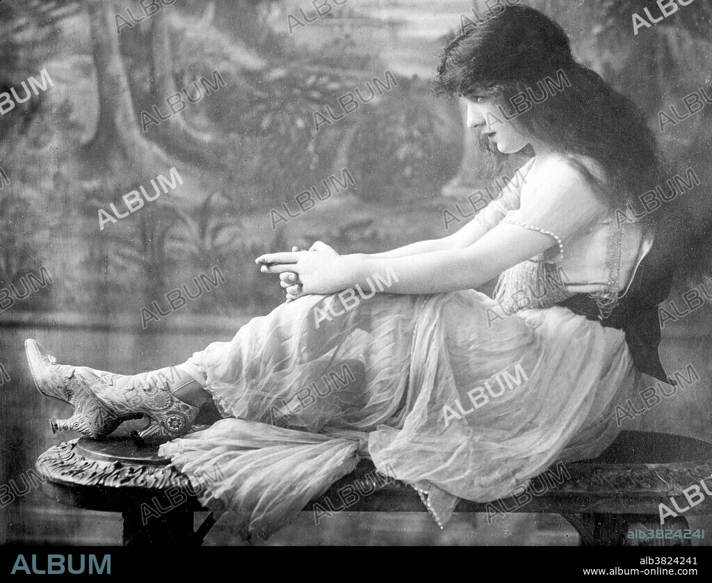 Florence Evelyn Nesbit (December 25, 1884 - January 17, 1967) was a popular American chorus girl and model. In the early 20th century, her face and figure was everywhere, appearing in newspapers, magazine advertisements and calendars, making her a cultural celebrity. She posed for many respected artists of the era, notably Charles Dana Gibson, who idealized her as a "Gibson Girl." She had the distinction of being an early "live model," in an era when fashion photography was just beginning its ascendancy. She attracted the attention of socialite and architect Stanford White, who became her lover and achieved world-wide notoriety when her jealous husband, multi-millionaire Harry Kendall Thaw, shot and murdered White, leading to what the press would call "The Trial of the Century." In the 1920s, she became the proprietor of either a tearoom or speakeasy located in Manhattan. It was during this period and well into the 1930s that she struggled with alcoholism and morphine addiction. She published two memoirs, The Story of My Life (1914), and Prodigal Days (1934). Nesbit died in 1967 at the age of 82. Bain News Service, August 30, 1913.