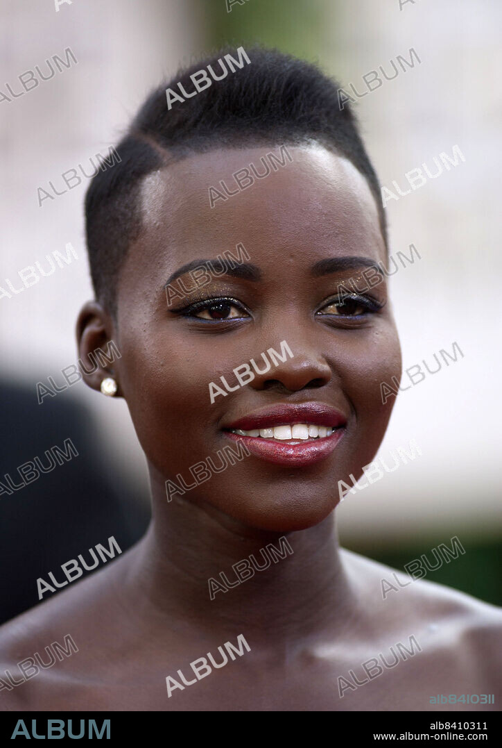 LUPITA NYONG'O.  April 23, 2104 - Kenyan actress LUPITA NYONG'O is named People Magazine's Most Beautiful Person for 2014. Nyong'o has as master's degree in acting from the Yale School of Drama and starred in her first feature film '12 Years a Slave (2013)' which earned her Golden Globe Award, BAFTA Award and Oscar for Best Supporting Actress. PICTURED: Jan. 12, 2014 - Beverly Hills, California, U.S - Lupita Nyongo arrives at the 71st Golden Globe Awards.(Credit Image: © Prensa Internacional/ZUMAPRESS.com).