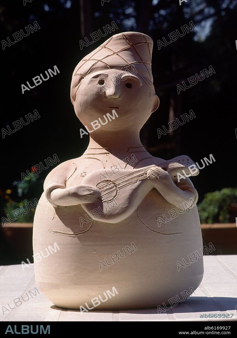 BOTIJO O HUCHA CON FORMA DE BATURRO-SIN VIDRIAR-CERAMICA POPULAR S XX.