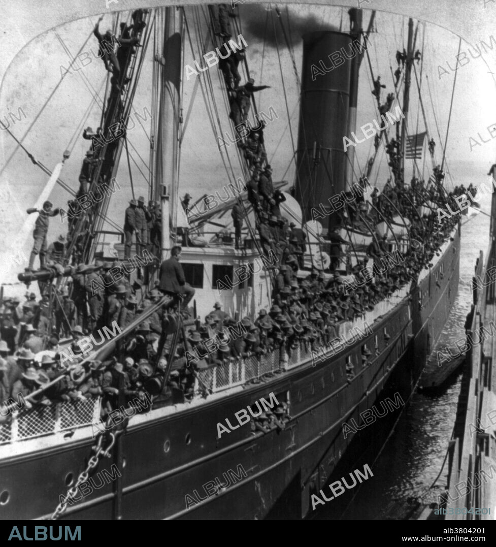 Entitled: "A thousand boys in blue on S.S. Rio de Janieiro bound for Manila." Showing U.S. troops on ship during Philippine Insurrection, 1898. The Philippine-American War (1899-1902) was an armed conflict between the United States and Philippine revolutionaries. The conflict arose from the struggle of the First Philippine Republic to secure independence from the United States following the latter's acquisition of the Philippines from Spain after the Spanish-American War. The war was a continuation of the Philippine struggle for independence that began in 1896 with the Philippine Revolution. Fighting erupted between United States and Philippine revolutionary forces on February 4, 1899, and quickly escalated into the 1899 Second Battle of Manila. On June 2, 1899, the First Philippine Republic officially declared war against the United States. The war officially ended on July 4, 1902. The war and occupation by the U.S. would change the cultural landscape of the islands, as people dealt with an estimated 34,000 to 220,000 Philippine casualties (with more civilians dying from disease and hunger brought about by war), disestablishment of the Roman Catholic Church in the Philippines, and the introduction of the English language in the islands as the primary language of government, education, business, industrial and increasingly in future decades among families and educated individuals. Cropped stereograph card photographed by Griffith & Griffith, 1898.