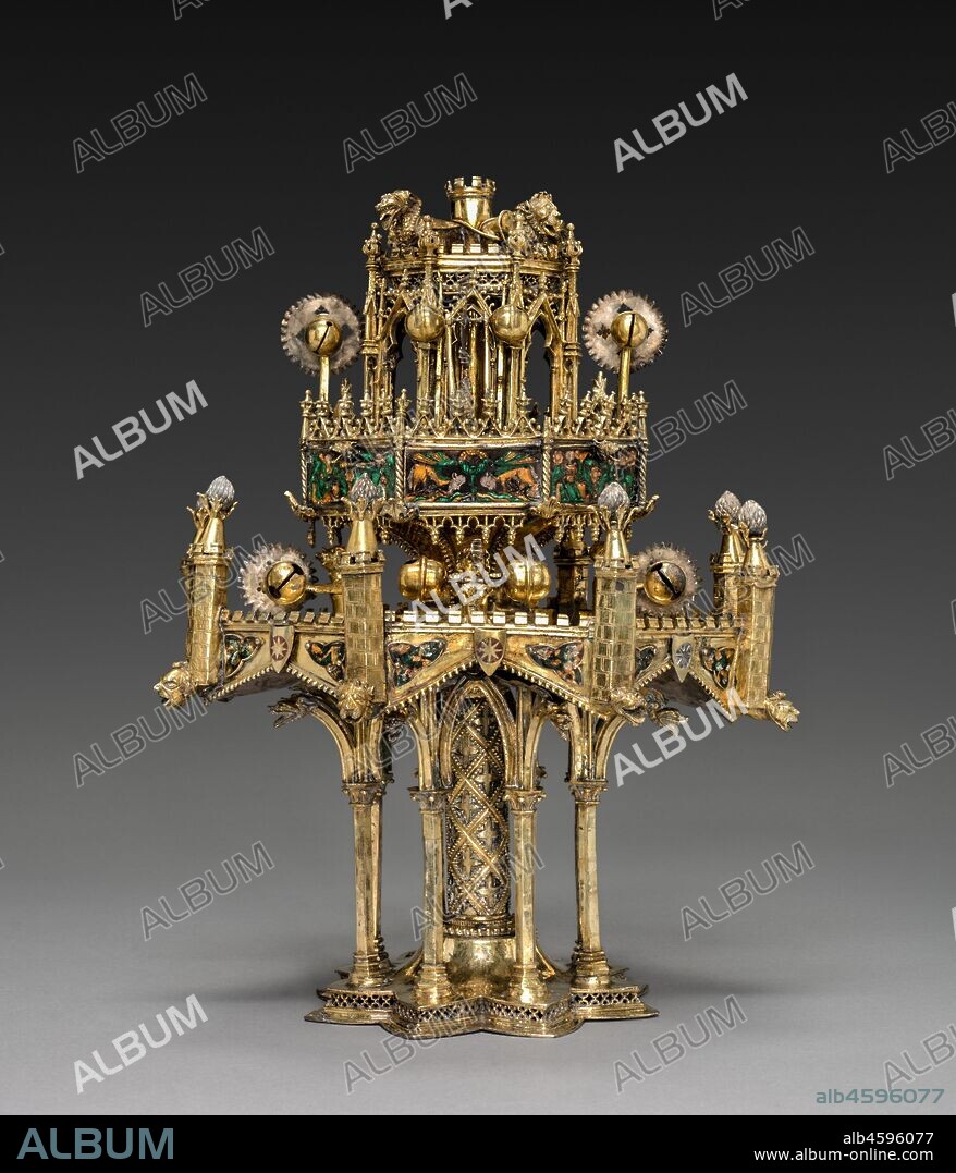 Table Fountain, c. 1320-40. Conceptually and stylistically, this object is beyond all else a piece of Gothic architecture in miniature with vaults, pinnacles, columns, and traceried arches. Though the artist who created it is unknown, he was unquestionably inspired by the great Gothic buildings of his time.  The table fountain is a three-tiered assembly combining cast elements with bent sheets of gilt-silver. To these have been attached a series of enamel plaques representing grotesque figures, some of which play musical instruments. Water wheels and bells were added to capture motion and sound.  The rich detail, precious materials, and involved ornamentation of this deluxe object suggest it would have been expensive to produce and highly treasured by its original owner, someone of high status, and would have been deployed as an object of spectacle. This is the most complete example of its type known to survive from the Middle Ages. Medieval inventories reveal that small fountains like this, often taking various forms, and generally made from precious metals, once existed in large numbers, thus making the Cleveland table fountain an extremely rare object.