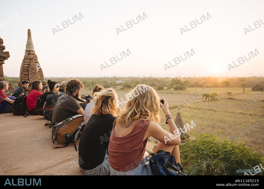 Tourists enjoying the sunset from Temple, Bagan (Pagan), Mandalay Region, Myanmar (Burma), Asia.