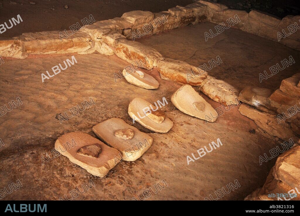 Long abandoned monos and metates for grinding corn and other foods among 13th century Anasazi ruins at Balcony House. Anasazi women spent hours every day grinding using with with these stones.