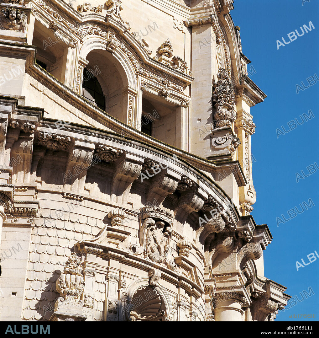San Matteo Church, Lecce, by Achille Carducci (or Larducci), 1667-1700, 17th Century, Lecce stone,. Italy, Puglia, Lecce, Lecce, San Matteo Church. Detail. Exterior view San Matteo church facade two tiers orders lower tier order convex upper tier order concave roofing tiles shingles architrave cornice Doric entablature triglyphs tympanum incorporates various styles trophies with floral decoration console with ogee moulding.