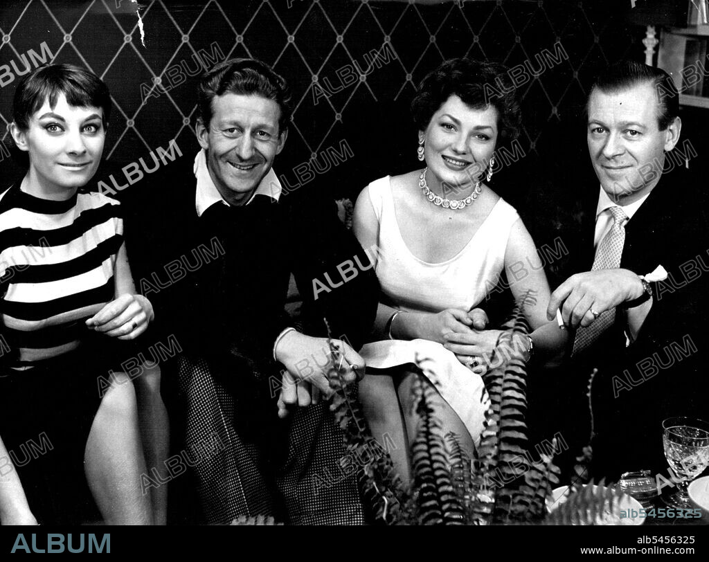 The Pertwee Brothers And Their Wives -- The two sons or dramatist Roland Pertwee photographed with their actress wives. Left, comedian Jon Pertwee and Jean Marsh; right, Michael Pertwee, like his father a playwright, and Valerie French, who is at present working in Hollywood. November 23, 1955. (Photo by Tom Blau, Camera Press).