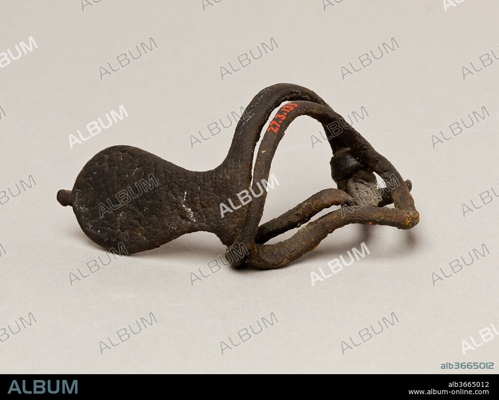 Archer's wrist guard. Dimensions: 6 x 5.5 cm (2 3/8 x 2 3/16 in.). Dynasty: Dynasty 12. Reign: Possibly Senwosret I. Date: ca. 1961-1917 B.C..
The archer's wrist guard was found in a mass grave of at least fifty-nine soldiers. Buried with the individuals were small pieces of military equipment such as bows and arrows, and this wrist guard still tied around the wrist of one man. The bodies showed evidence of violence, and from their wounds it was apparent that they died on the battlefield. The excavator believed that these "slain soldiers" were connected with a specific historical event that lead to the reunification of Egypt under Mentuhotep II, but reevaluation of the evidence does not support this theory. On the corners of their linen wrapping sheets were inscriptions, some with names that were only popular later, in early Dynasty 12. Moreover, the paleography of the inscriptions and the type of wrist guard found with the soldiers also point to an early 12th dynasty date, which can perhaps be narrowed down to the reign of Senwosret I (the second king of Dynasty 12).