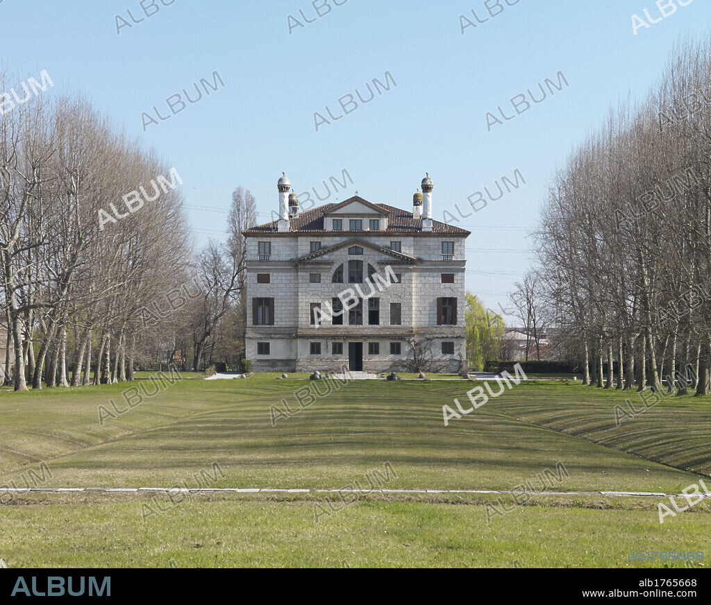 Villa Foscari, Gambarate di Mira, Malcontenta, by Battista Franco known as Semolei, Andrea di Pietro della Gondola known as Palladio, Giovan Battista Zelotti, 1559-1566 about, 16th Century,. Italy, Veneto, Venice, Mira-Gambarate, Villa Foscari La Malcontenta. View exterior facade Villa Malcontenta garden park park leafless branches meadow lawn, 2009 photograph.