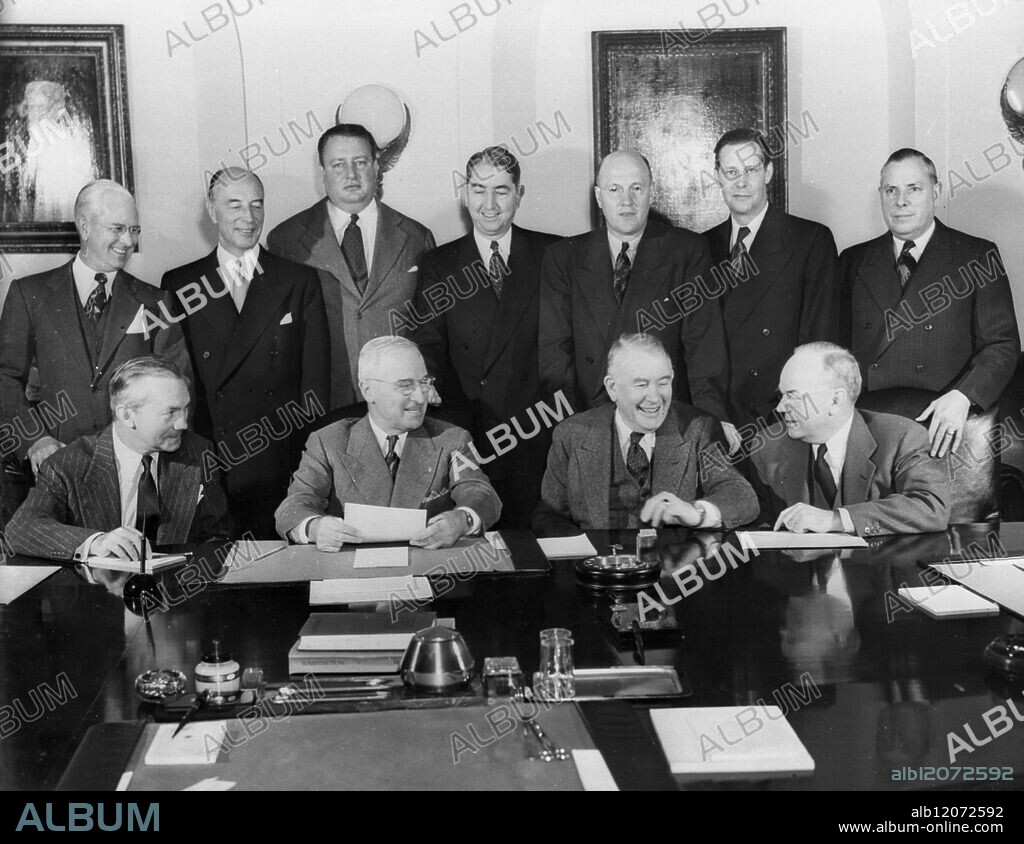 President Truman is shown as he presided at the final Presidential Cabinet Meeting before the President's inauguration. Seated LtoR - Defence Secretary James Forrestal; President Truman; Vice President Elect Alben W Barkley; Treasury Secretary John W Snyder. Standing LtoR - Commerce Secretary Charles Sawyer; Acting Secretary of State Robert Lovett; Interior Secretary Julius A Krug; Attorney General Tom Clark; Agriculture Secretary Charles Brannan; Labour Secretary Maurice Tobin; Postmaster General Jesse Donaldson.