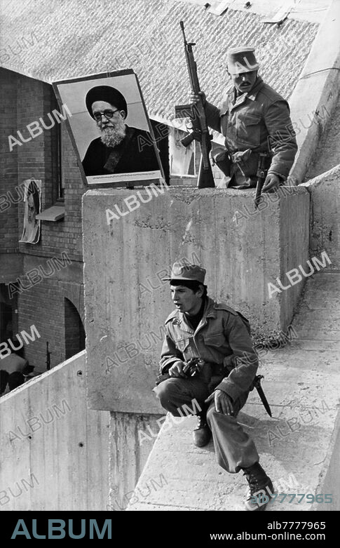 Iranian Revolution, Tabriz / Photo 1979Iranian Revolution / Tabriz / Kazem Shariatmadari against Ayatollah Khomeini. In Tabriz (East Azerbaijan in Iran) followers of the Ayatollah Mohammad Kazem Shariatmadari climb the roof of the TV building. They present a portrait of Ayatollah Kazem Shariatmadari. Photo, 09.12.1979.