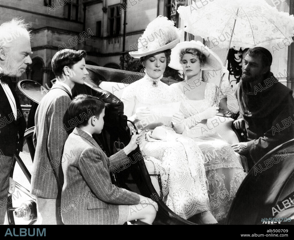 BRIAN AHERNE, GRACE KELLY and JESSIE ROYCE LANDIS in THE SWAN, 1956, directed by CHARLES VIDOR. Copyright M.G.M.