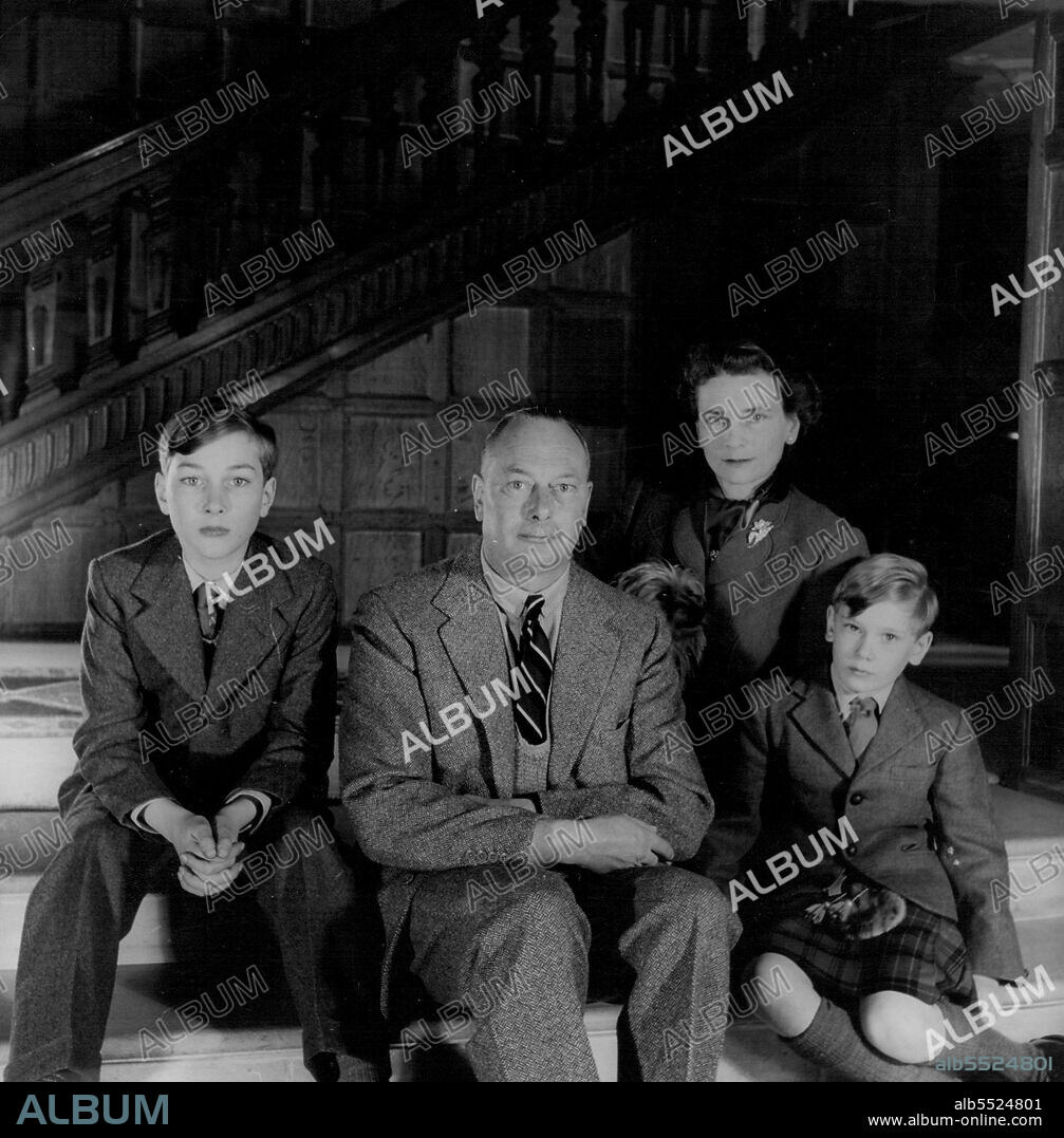 At Barnwell Manor, Northants -- The Gloucester At Home -   A family group in the Hall of Barnwell Manor. From left to right - Prince William (aged 11 1/2), H.R.H. The Duke of Gloucester, H.R.H. The Duchess of Gloucester, and Prince Richard (aged 9 1/2). Between, the Duke and the Duchess, one of the two Australian collies which are the pet dogs of the young Princes. March 02, 1955. (Photo by Tim Blau, Camera Press).