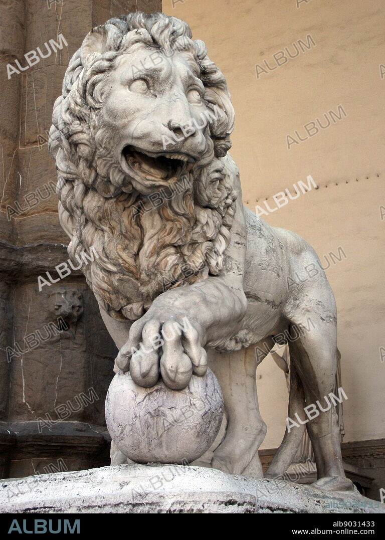 One of the Medici lions displayed at the Loggia dei Lanzi, Florence, Italy. One of two marble lion sculptures originally placed around at the Villa Medici (circa 1600 AD) and displayed at the Loggia dei Lanzi since 1789. The sculpture depicts a standing male lion looking to the side, with a sphere under his paw. The first lion originates from the 2nd century BC. It was a relief that was reworked by Giovanni di Scherano Fancelli in 1598. The second was made sometime between 1570 and 1598 by Flaminio Vacca as a pendant to the first.