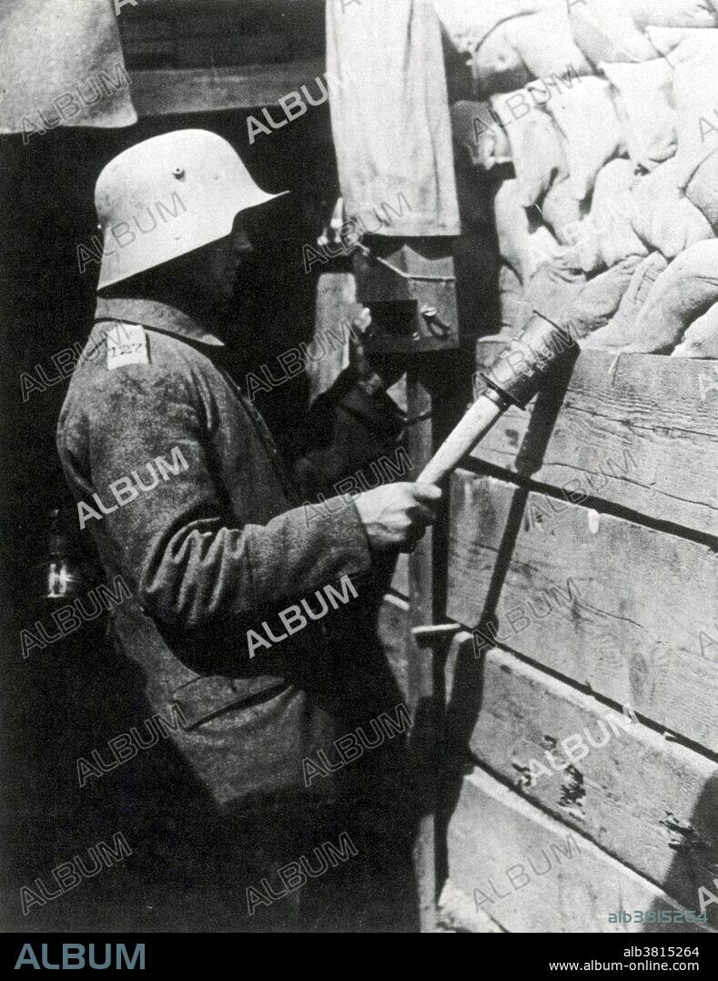 Caption: "German sentry of the 127th Regiment, armed with the potato-masher hand grenade and looking through a trench periscope in the Ypres area, 1916." The most prominent case of trench warfare is the Western Front in WWI. Both sides constructed elaborate trench and dugout systems opposing each other along a front, protected from assault by barbed wire. The area between opposing trench lines (no man's land) was fully exposed to artillery fire from both sides. Attacks, even if successful, often sustained severe casualties. The common infantry soldier had only a few weapons to use in the trenches: the rifle, bayonet, and hand grenade. The Model 24 Stielhandgranate was the standard hand grenade of the German Army for both World Wars. It is one of the most easily recognized infantry weapons of the 20th century. The British Army nicknamed them the "potato masher".