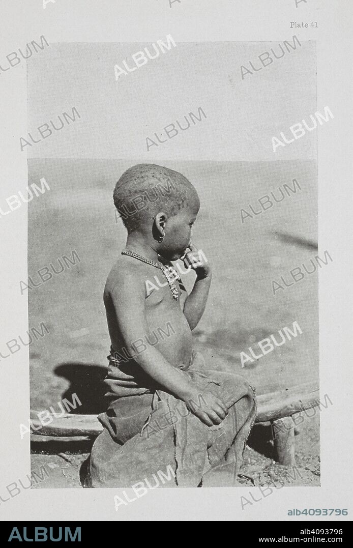 DUDLEY KIDD. Disconsolate.  A Pondo baby, sitting on a Pondo "pillow". The Essential Kafir ... With one hundred full-page illustrations by the author. London : Adam & Charles Black, 1904. Source: 10096.h.20 plate 41.